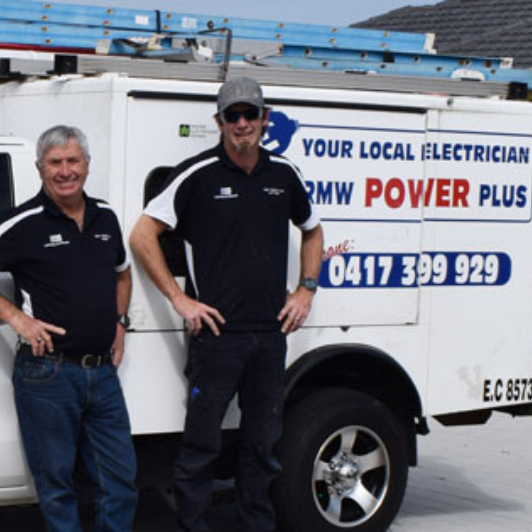 Rob and Matthew standing in front of the RMW Power Plus work van